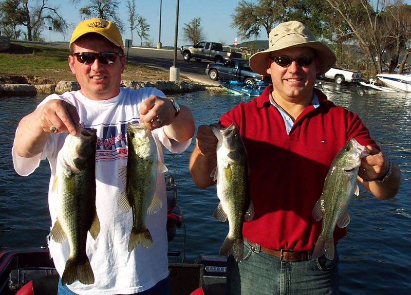 Two anglers with largemouth bass on a spring 2005 guide trip