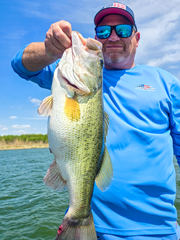 Mark with a 5.25 lb bass from Falcon Lake
