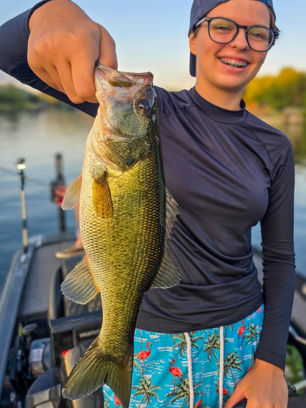 Young angler with the first largemouth bass of the morning on the upper end of Lake Austin