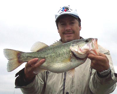 Guide Bryan Cotter with a nice fat largemouth bass, January 2005