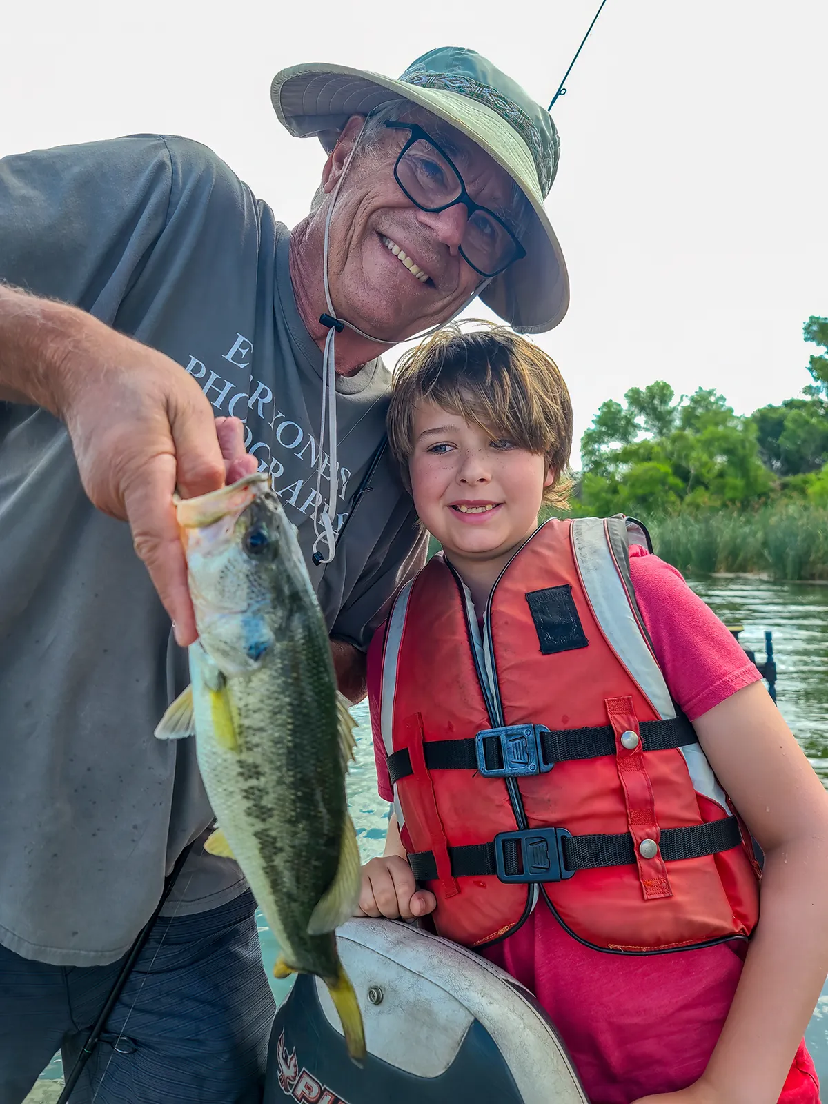 Grandfather Grandson — bass fishing catch with Texas Hawgs