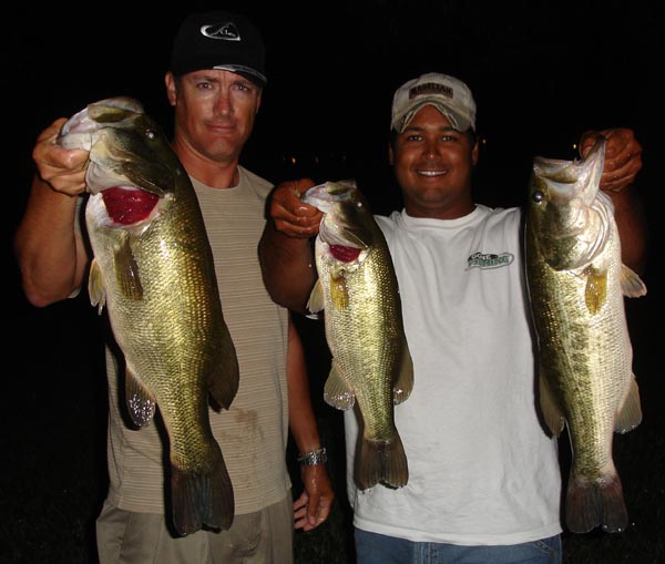 Two anglers with big largemouth bass caught at night on Lake Austin, September 2007