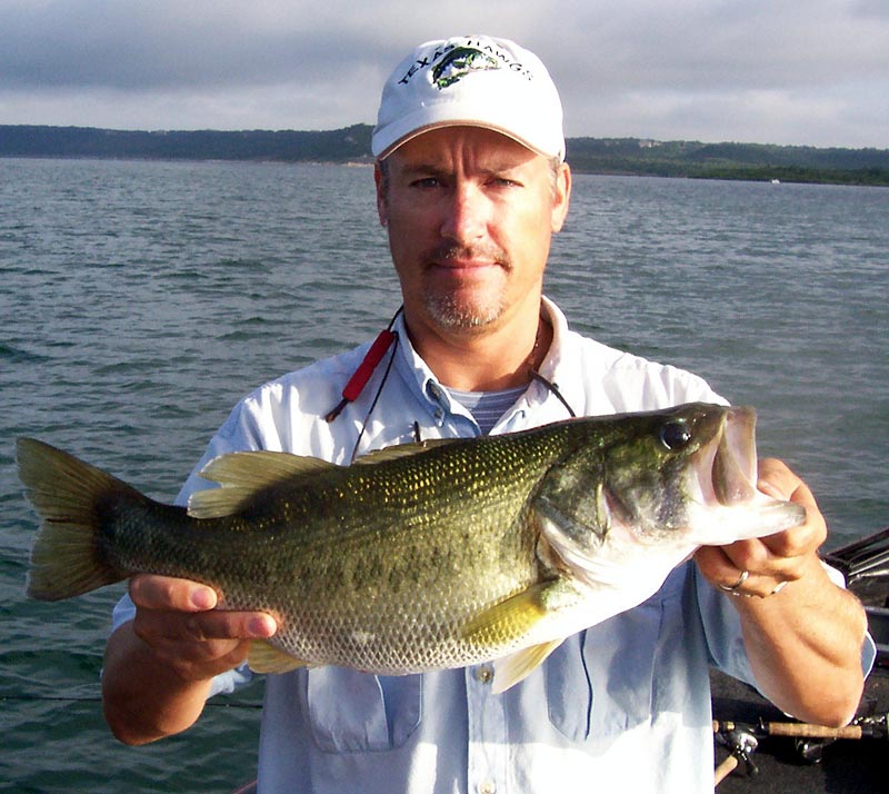 Angler with a Stillhouse Hollow largemouth, July 2006