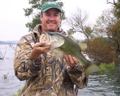 Robert holding a largemouth bass at Stillhouse Hollow in fall 2004