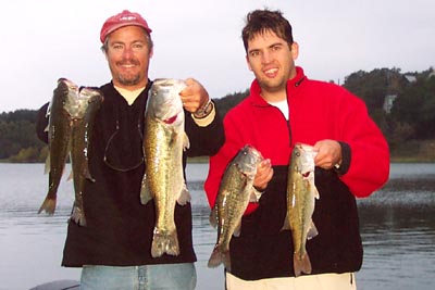 Jason and I holding our limit of Lake Travis largemouth bass, November 2004